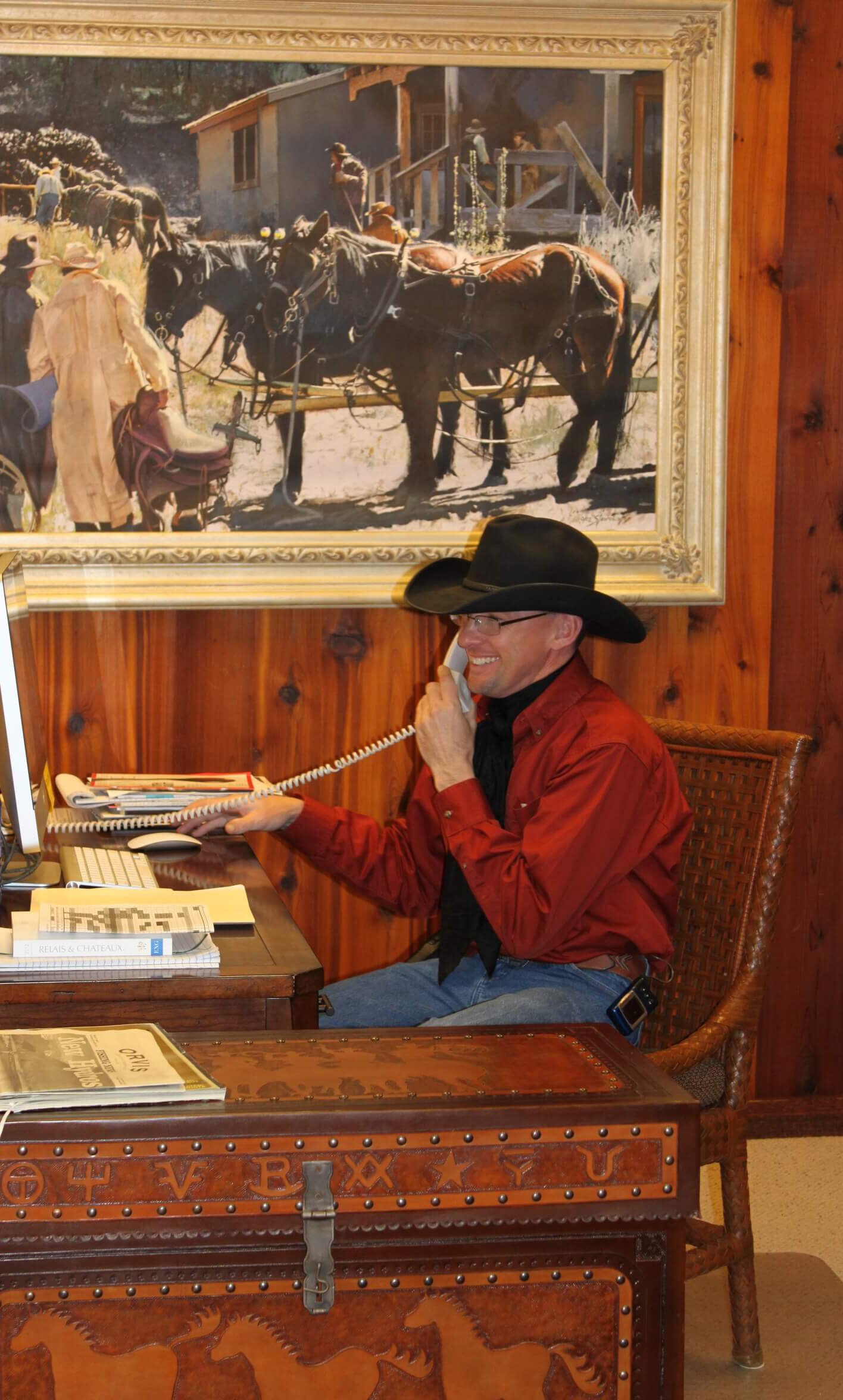 Jared the Cowboy Taking a Call in the Activities Center